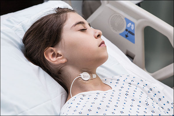 Masimo - Acoustic Respiration Rate - small child in hosiptal bed with RRa sensor on neck