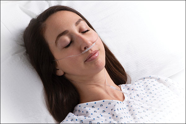 Masimo - NomoLine Capnography woman laying in hospital with nasal