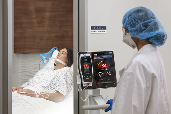 Masimo - Doctor outside of patient room monitoring via Root device