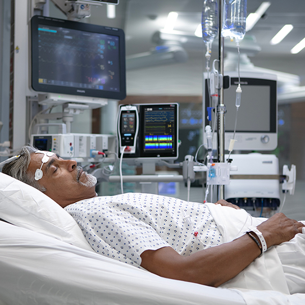 Hospital patient using Masimo monitors and sensors for continuous vital signs and brain function monitoring.